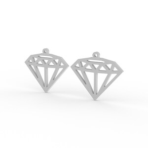 May include: Two silver-colored diamond-shaped pendants. Each pendant has a geometric design with multiple facets and a small loop at the top for hanging. The pendants are displayed against a white background.