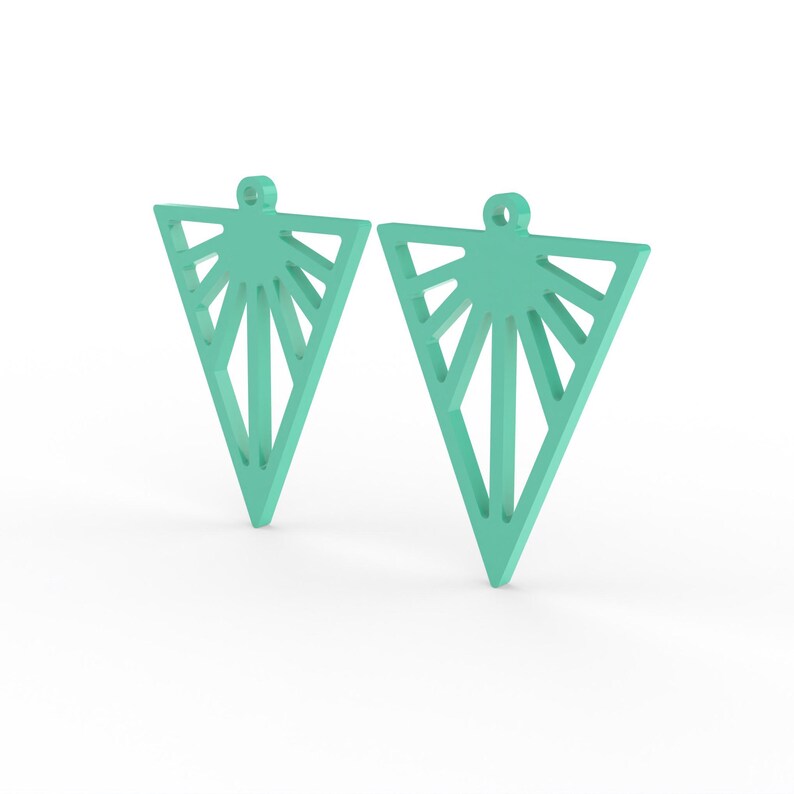 May include: Two turquoise geometric earrings. Each earring is a triangle shape with a sunburst design. The earrings have a small loop at the top for hanging. The earrings are displayed on a white background.