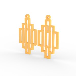 May include: A pair of geometric earrings in a light orange color. Each earring features a series of rectangular shapes arranged in a vertical pattern, with a small loop at the top for hanging. The design is modern and minimalist.