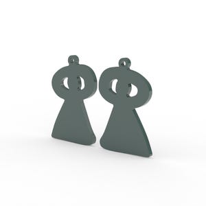 May include: Two dark gray, abstract-shaped pendants. Each pendant has a rounded top with a circular cutout and a teardrop-shaped base. The pendants are displayed against a white background.