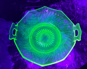Vintage Green Uranium / Depression Glass Serving Bowl with a Twised optics pattern and handles. Has a few chips and one hair line crack