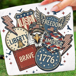 May include: White square fabric with patriotic graphics. Features an eagle wearing a camouflage hat with an American flag, surrounded by badges with the words "USA", "Liberty", "Freedom", "America", "Brave", and "1776".