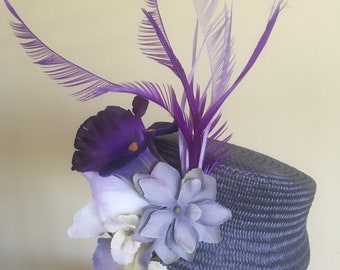 Purple blue periwinkle hat, twisted Biot feathers, contrasting flowers