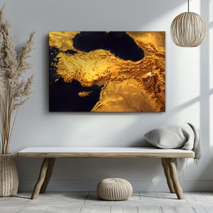 May include: A rectangular wall art print featuring a high-contrast, golden-toned topographic map of Turkey and the surrounding Mediterranean region. The landmasses are rendered in shades of bright gold and amber, contrasting against deep navy blue seas.