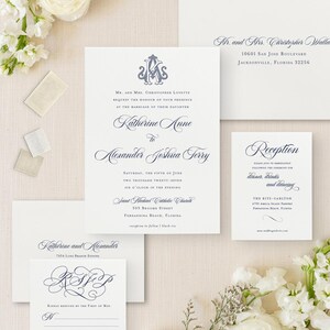 May include: A wedding invitation suite with a navy blue and white color scheme. The invitation features a monogram with the initials "KA" and the names "Katherine Anne" and "Alexander Joshua Terry". The reception card features the text "Reception" and the details for the reception. The RSVP card features the names "Katherine and Alexander" and a monogram with the initials "KA".