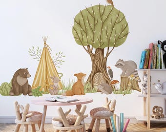 May include: A whimsical children's room scene featuring woodland animal wall decals, a teepee, and a large tree. A pink table and wooden chairs with deer-shaped backs are in the foreground. A rug, bookshelf, and decorative items complete the playful setting.