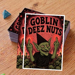 May include: A stack of cards featuring a green goblin illustration with the text "GOBLIN DEEZ NUTS" in black letters on a red background. The goblin is giving the middle finger.