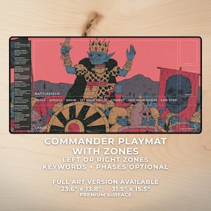 May include: Commander playmat with zones featuring a fantasy illustration of a goblin king holding a sword. The mat has a pink background and includes zones for gameplay. Dimensions are 23.6" x 13.8" and 31.5" x 15.5".