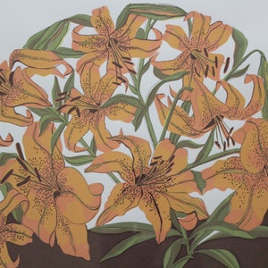 May include: A vintage print of a bouquet of orange lilies with brown stems and green leaves. The lilies are arranged in a circular pattern on a white background.