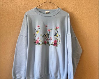 Sudadera vintage de los 80 con estampado de pájaros primaverales en azul claro, talla M.