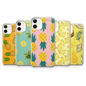 May include: Five phone cases with pineapple patterns in various designs. The cases display whole pineapples, pineapple slices, and pineapple shapes on yellow, pink, and teal backgrounds. The cases are designed for a mobile phone.
