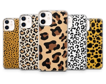May include: A collection of five phone cases with various leopard print designs. The cases feature a range of colors, including tan, brown, black, and white. The cases are designed to fit a smartphone.