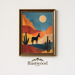May include: Framed art print featuring a desert landscape with a donkey silhouette, cacti, and a full moon. The color palette includes shades of orange, blue, and yellow. The artwork is from the Rustwood Gallery.