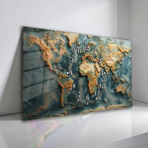 May include: A wall clock featuring a detailed map of the world with a blue and gold color scheme. The clock face is integrated into the map design, with black numerals and gold hands. The clock is rectangular and mounted on a white wall.