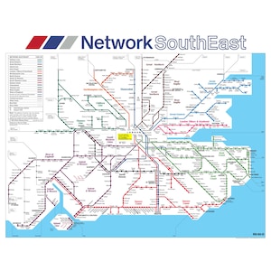 May include: A detailed map of the Network SouthEast rail system, showing train lines in various colours against a light blue background. The map includes the text "Network SouthEast" at the top, with a colour-coded legend on the left.