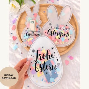 Op de afbeelding: Drie paas-thema doorzichtige plastic containers gevuld met kleurrijke confetti. Twee zijn konijnvormig en één is eivormig. Tekst op de containers luidt "Ein kleiner Gruß vom Osterhasen", "Ein hasiger Ostergruß" en "Frohe Ostern".