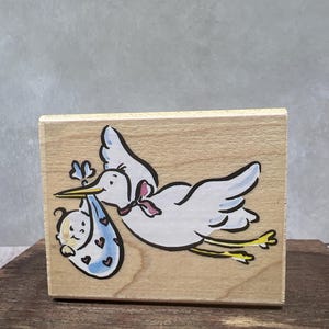 Cigogne avec bébé Tampon OCCASION Voir toutes les photos Stampede