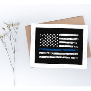 May include: A white and blue American flag with a thin blue line across the middle, on a black background. The flag is distressed and has a grunge effect.