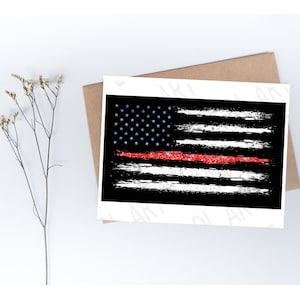 May include: A distressed American flag design with a red line, stars, and stripes. The flag is printed on a white card, set against a brown envelope and a white background. The flag's design features a black background with white stripes and a red line.