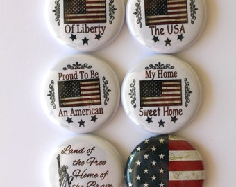 May include: Set of six patriotic button pins with American flag designs and patriotic sayings. The sayings include "Sweet Land of Liberty", "Hooray For The USA", "Proud To Be An American", "My Home Sweet Home", "Land of the Free Home of the Brave", and a button with just the American flag.