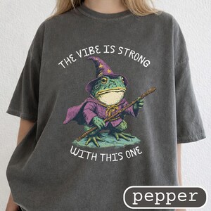 May include: A set of three ceramic mugs with a speckled, matte finish. Each mug is a different colour: light blue, cream, and grey. The mugs have a simple, modern design with a rounded shape and a handle.