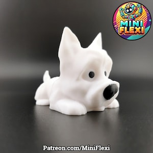May include: A white 3D-printed dog figurine with black eyes and nose. The dog is lying down, with its ears perked up. The image includes the text "Patreon.com/MiniFlexi" at the bottom and a logo in the upper right corner.