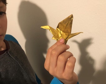 Gru dipinta d'oro