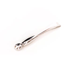 May include: A polished silver-toned metal applicator tool featuring a smooth, rounded spherical tip attached to a slender, tapered handle. The surface of the metal is highly reflective, showing a bright, clean finish throughout the entire object.
