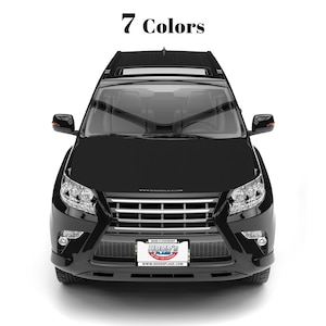 May include: A black SUV with a front view, showcasing headlights, a grille, and a license plate that reads "Hood's Flags." The text "7 Colors" is displayed at the top. The vehicle is set against a white background.