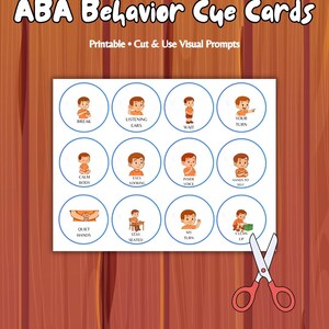 May include: A sheet of twelve circular ABA Behavior Cue Cards featuring illustrations of a child in an orange shirt with text labels including Break, Listening Ears, Wait, Your Turn, Calm Body, Eyes Looking, Inside Voice, Hands to Self, Quiet Hands, Stay Seated, My Turn, and Clean Up, with a pair of red scissors.