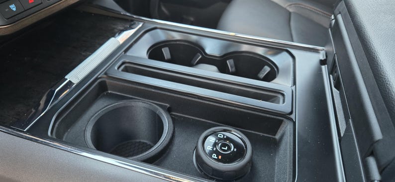 RevoShift console installed with rotary shifter and cupholders