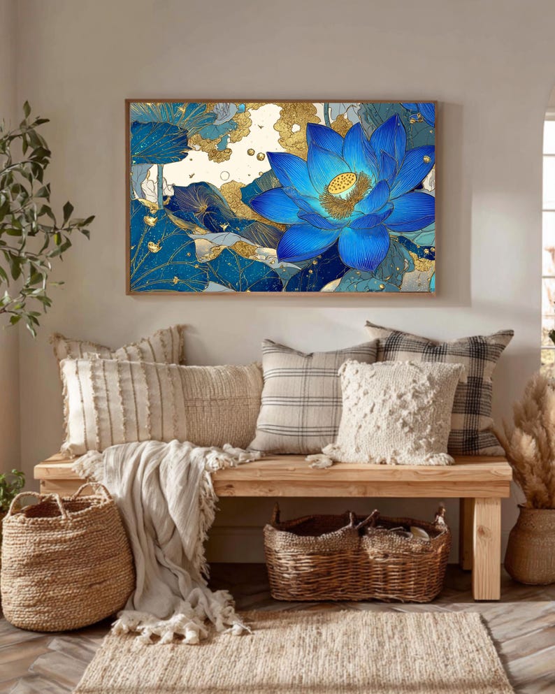 May include: A framed wall art print featuring a vibrant blue lotus flower with gold accents. The artwork is displayed above a wooden bench with decorative pillows, baskets, and a rug, creating a cozy and inviting interior design.