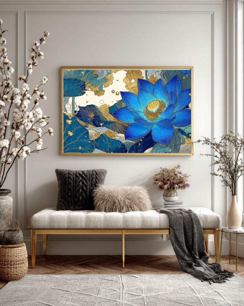 May include: A framed art print featuring a vibrant blue lotus flower with gold accents. The artwork is displayed above a bench with decorative pillows and a throw blanket. The room is decorated with neutral tones and natural elements.