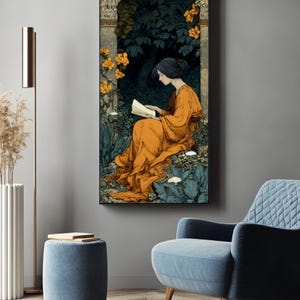 May include: A vertical rectangular wall art print featuring an illustration of a figure in a flowing orange dress sitting in a dark, lush garden setting while reading an open book. The scene includes stone pillars, dark green foliage, and bright orange flowers.