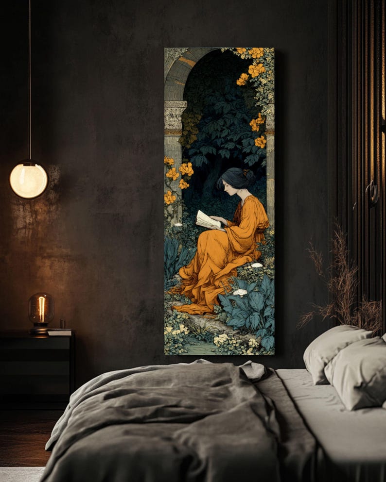 May include: A tall, rectangular wall art print featuring an illustration of a person with dark hair wearing a long, flowing orange dress, sitting and reading a book within a stone archway surrounded by dark green foliage and bright yellow flowers.
