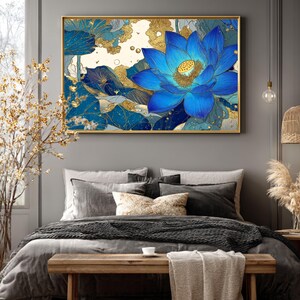 May include: A framed wall art print featuring a vibrant blue lotus flower with gold accents. The artwork showcases intricate details and a blend of blue and gold hues. The floral design is set against a neutral background, creating a striking visual contrast. The frame is gold.