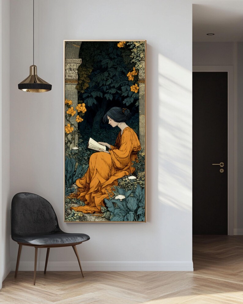 May include: A vertical rectangular wall art print featuring a person with dark hair wearing a flowing orange robe, sitting and reading an open book. The scene is set within a dark, lush garden with stone architectural elements and bright yellow flowers.