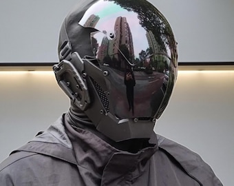 May include: A futuristic, dark gray helmet with a reflective visor, showcasing a city reflection. The helmet features intricate mechanical details and a sleek, modern design, suggesting a cyberpunk or sci-fi aesthetic.