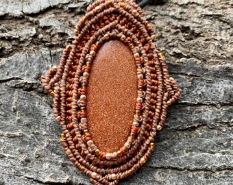 Goldstone macrame wrapped stone pendant