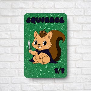 May include: A whimsical illustration of a squirrel holding a dagger, wearing a cape and acorn hat. The word "SQUIRREL" is at the top of the green background. The card is numbered 1/1.