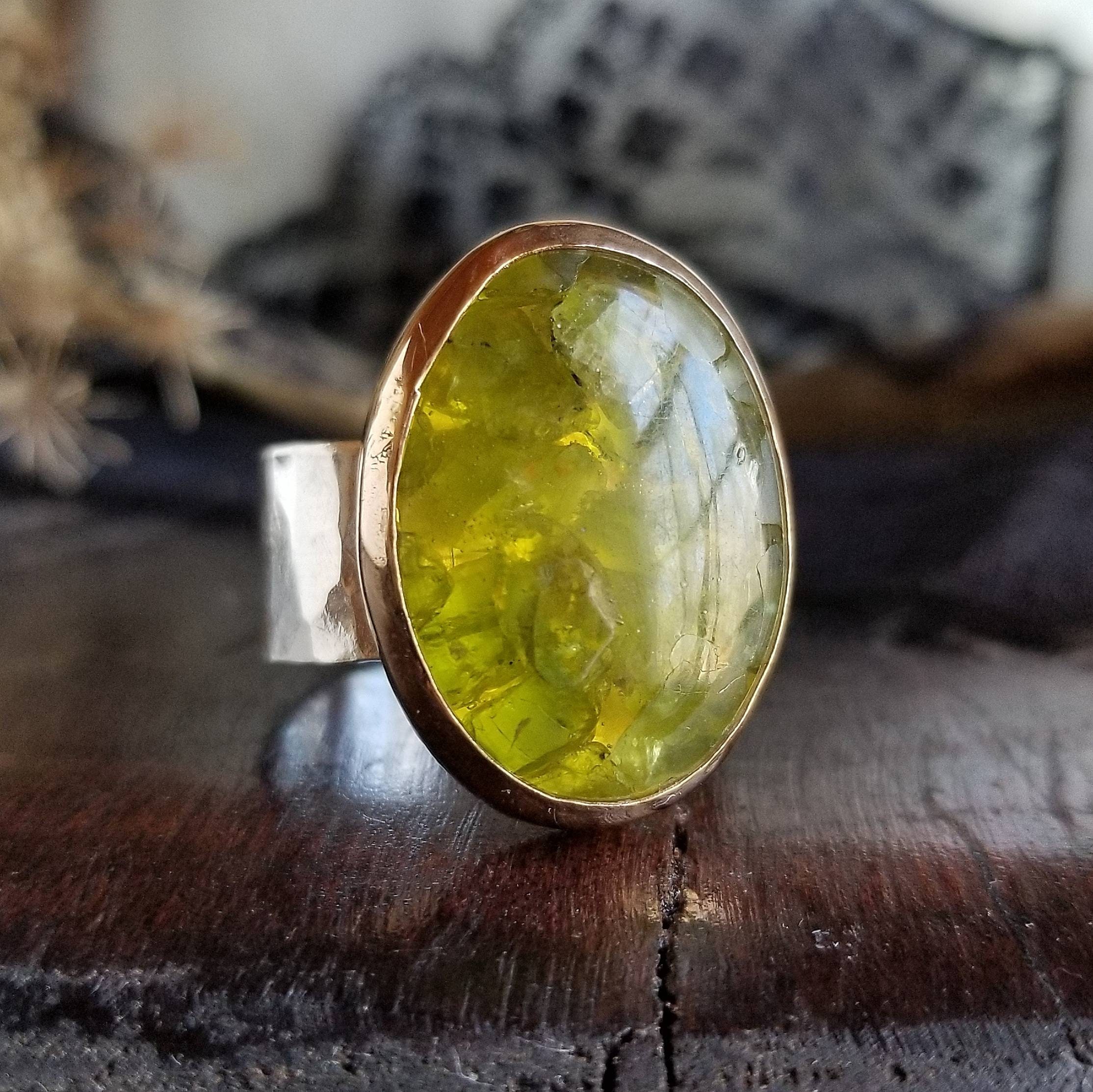 Gold ring with store peridot stone