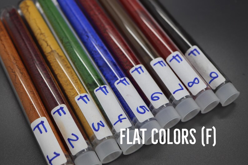 A collection of test tubes containing various colored liquids, each labeled with a number, arranged in a row.
