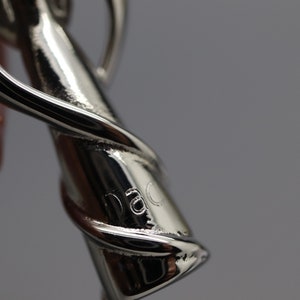 a close up of a person holding a pair of scissors