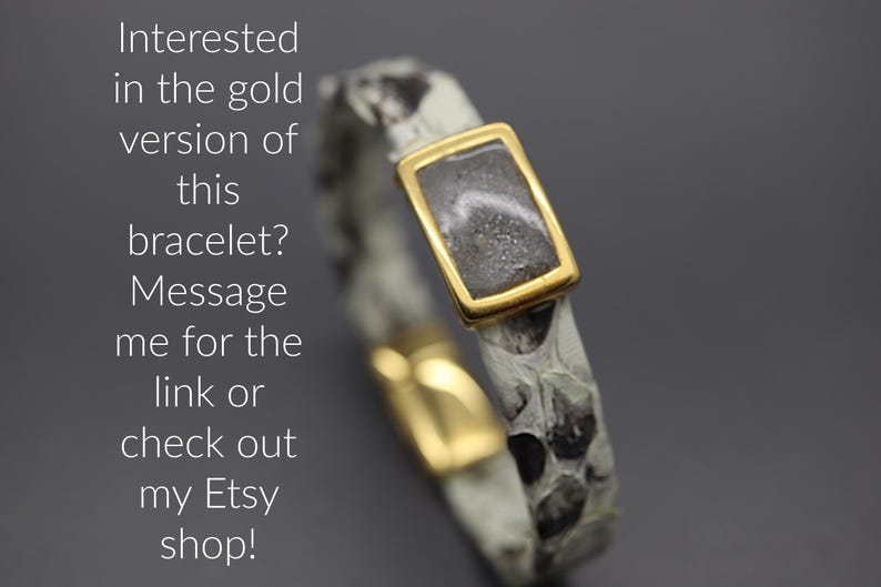 a gold ring with a message written below it