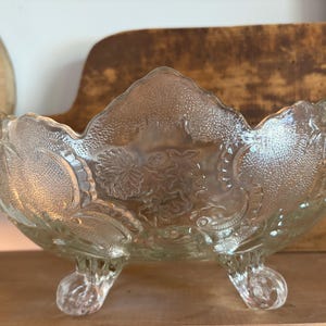 May include: A set of three ceramic mugs with a speckled, matte finish. Each mug features a different color: light blue, cream, and gray. The mugs have a simple, modern design and a comfortable handle.