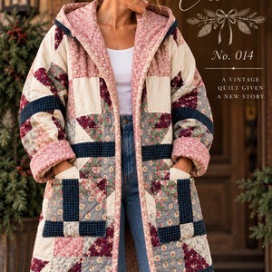 May include: A hooded coat constructed from patchwork quilt fabric featuring floral and geometric patterns in shades of cream, navy blue, and burgundy. The garment includes two large front pockets and text reading THE RESCUED Collection No. 014.