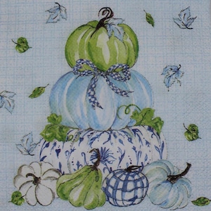 May include: A decorative image features a stack of three pumpkins in shades of green and blue, adorned with a checkered bow. Additional pumpkins in various shapes and colors are scattered around the base, with leaf accents on a light blue background.