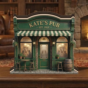 May include: A miniature green and white pub facade with the text "KATE'S PUB" and "EST. 19XX". The pub features a striped awning, arched windows, and a door with a shamrock. Includes a small barrel and stools.