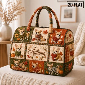 May include: A quilted duffel bag featuring a patchwork design with illustrations of small dogs wearing sweaters, pumpkins, and autumn leaves. The centre panel displays the word Autumn in cursive script. The bag has two top handles and a zip closure.
