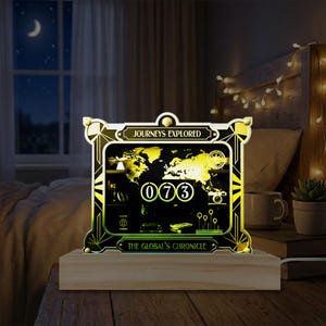 May include: A decorative illuminated sign with the text "Journeys Explored" and "The Global's Chronicle". The sign features a world map, the number "073", and travel-themed icons. It is set on a wooden base and glows with a warm light.